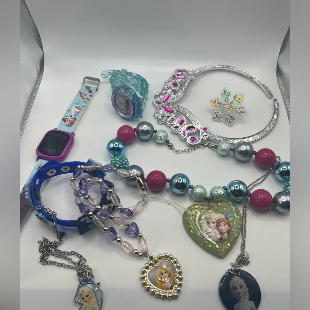 Lot of frozen jewelry from Disney!  Includes working watch
